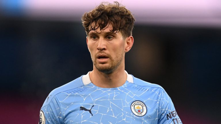Stones sends Man City 13 points clear