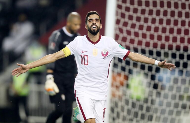 Hassan Al Haidos scores as Qatar overcome Oman to top group