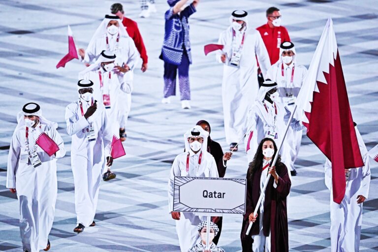 Pandemic-hit Tokyo Olympics open in low-key ceremony without fans