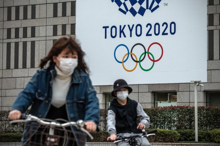 Olympic organisers defend coronavirus measures as cases rise