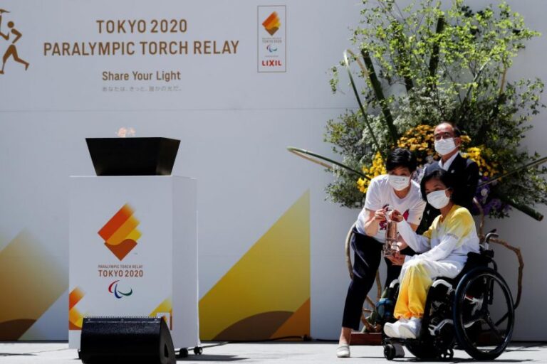 Paralympic flame arrives in Tokyo as virus surges days before opening