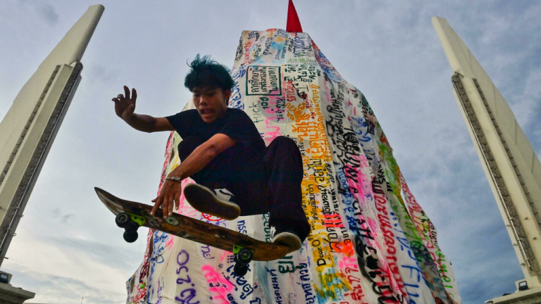 Wheels up: Bangkok protesters skate for democracy