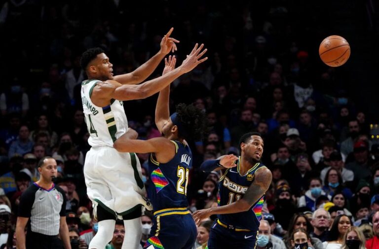 Bucks roll over short-handed Nuggets, Suns win 15th straight