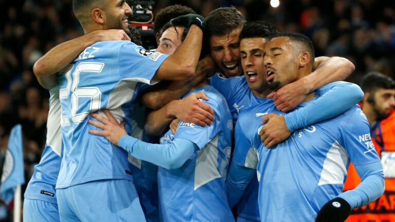 Man City take top spot, PSG through despite defeat