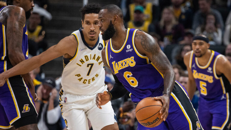James shines late as Lakers down Pacers in overtime, Warriors beat Sixers